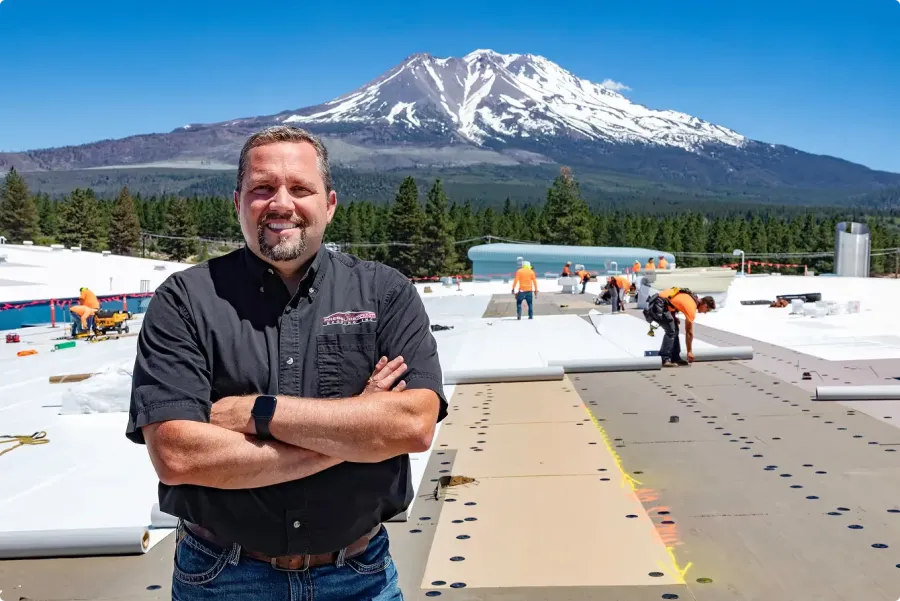 Pressure Point Roofing project on a commercial flat roof with the Cascade mountains behind